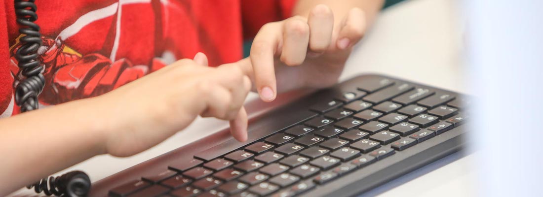 Student's hands using the keyboard