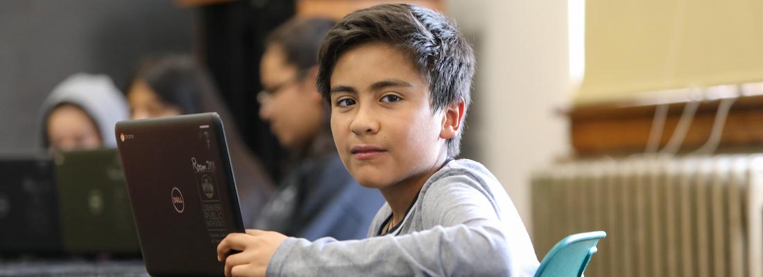 Student in class using a laptop