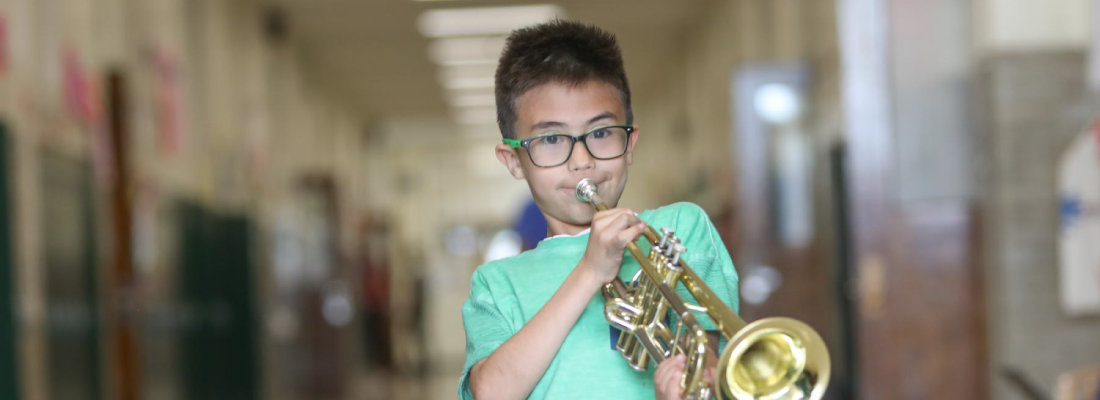 boy playing trumpet